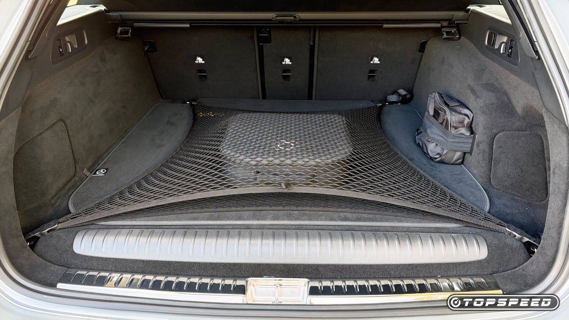Cargo area of the 2026 Mercedes-AMG E 53 Hybrid Wagon with the rear compartment open