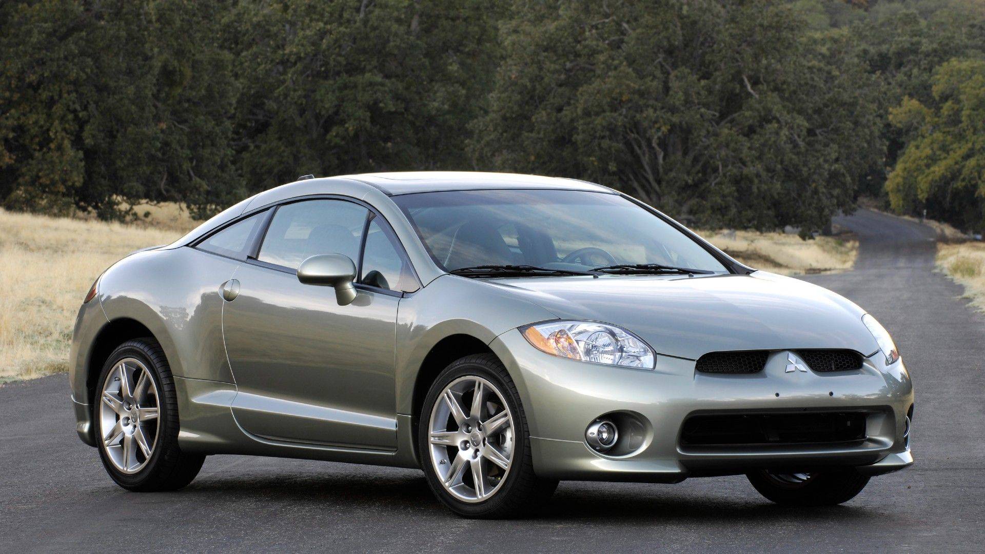 2008 Mitsubishi Eclipse GT coupe in silver from the front three-quarter angle