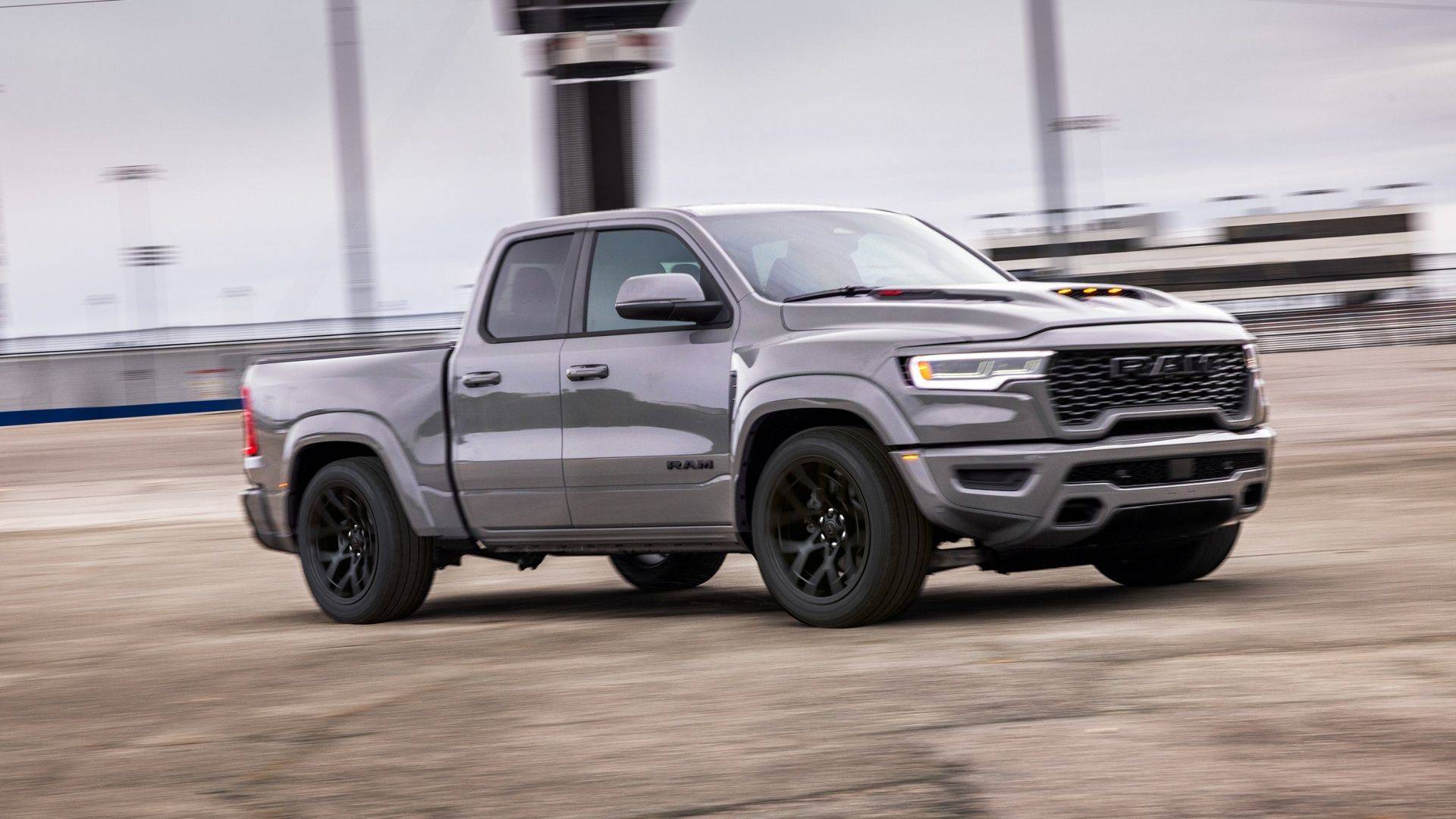 Front view of a red Ram 1500 on a paved track