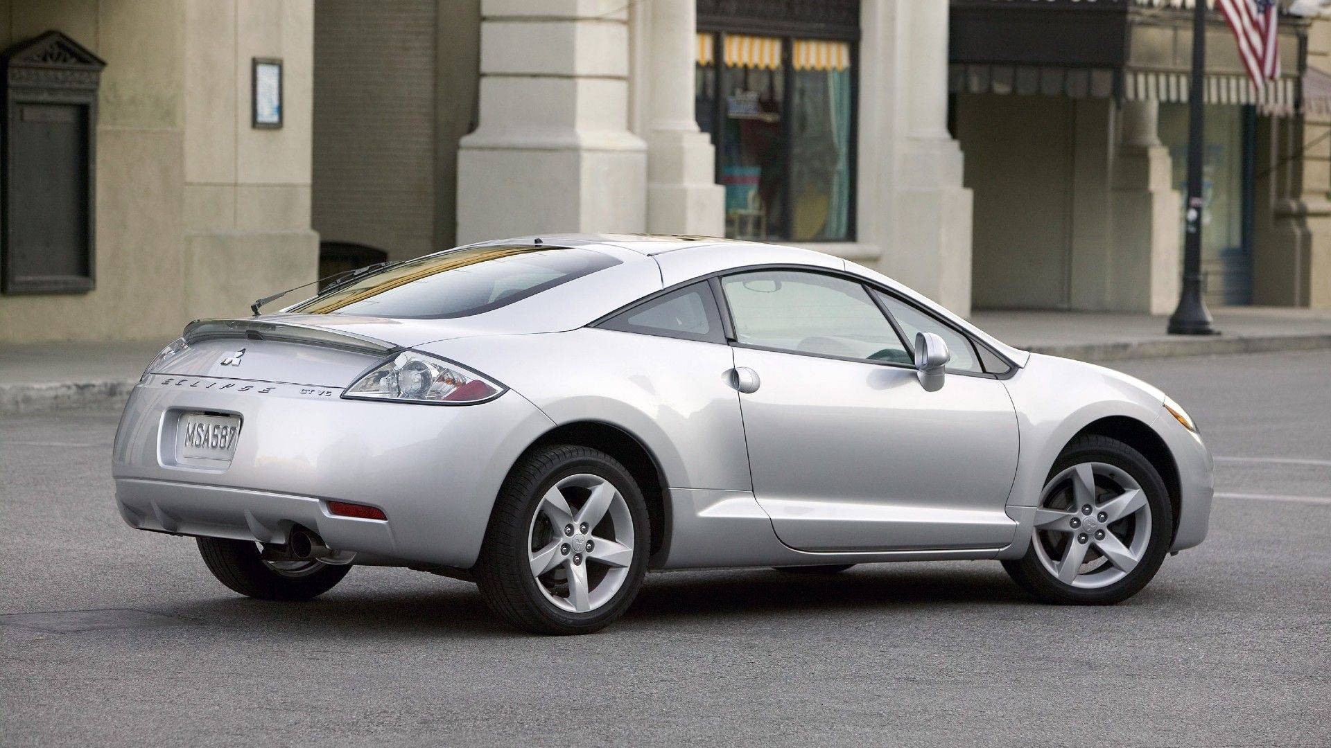 Silver 2008 Mitsubishi Eclipse GS rear three-quarter view