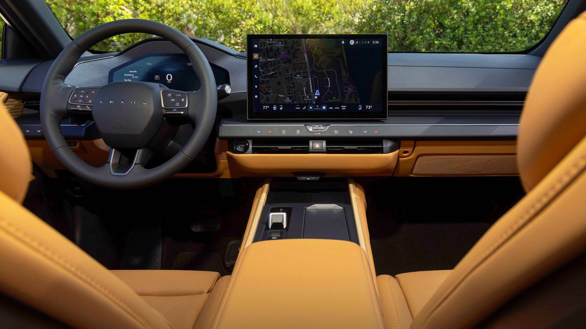 Lexus ES interior with tan leather seats, digital dashboard, and central touchscreen