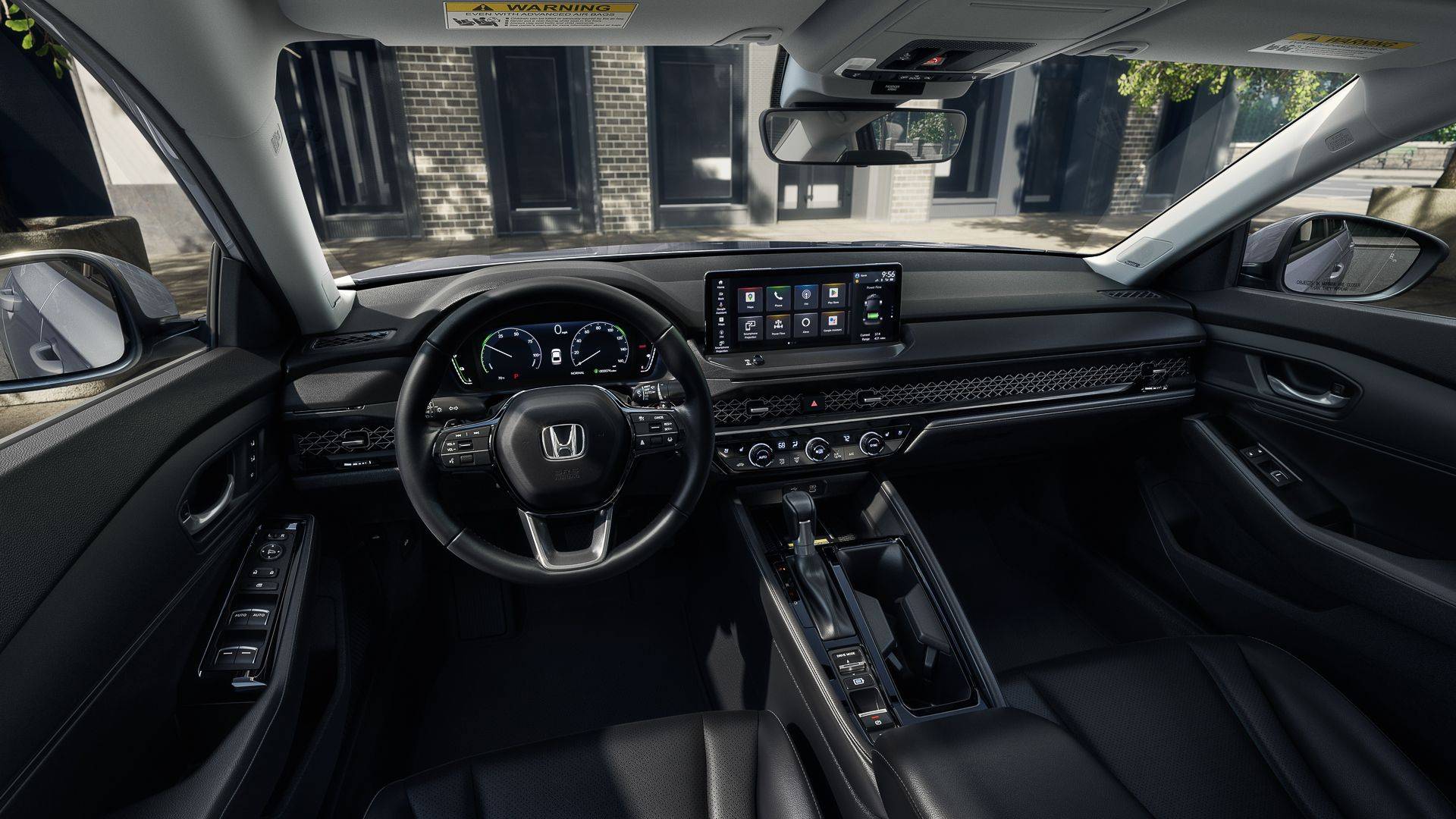 Honda Accord interior with steering wheel, digital dashboard, center touchscreen, and front passenger area.