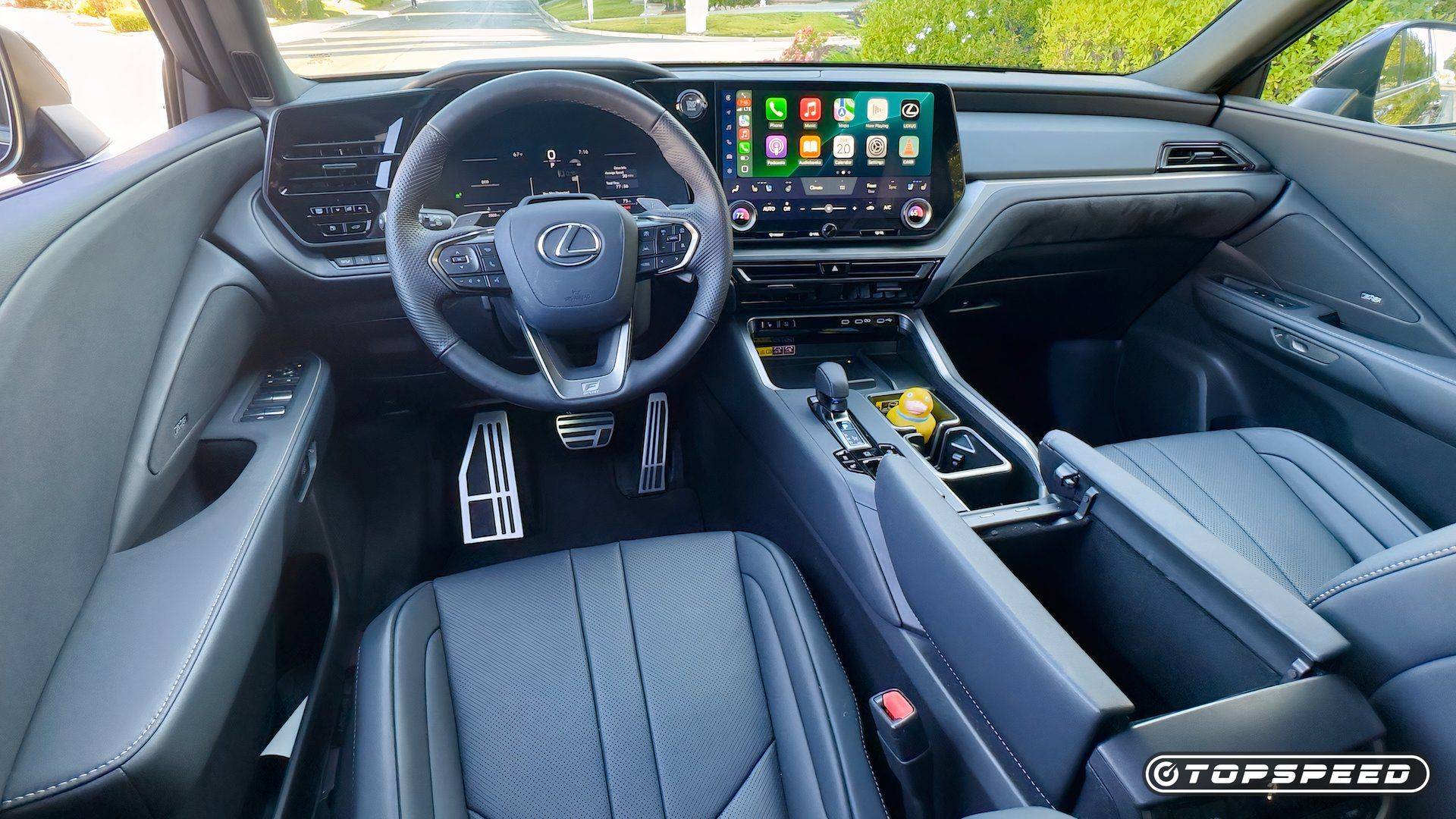 Lexus TX 350 F Sport cockpit overview with touchscreen and front seats