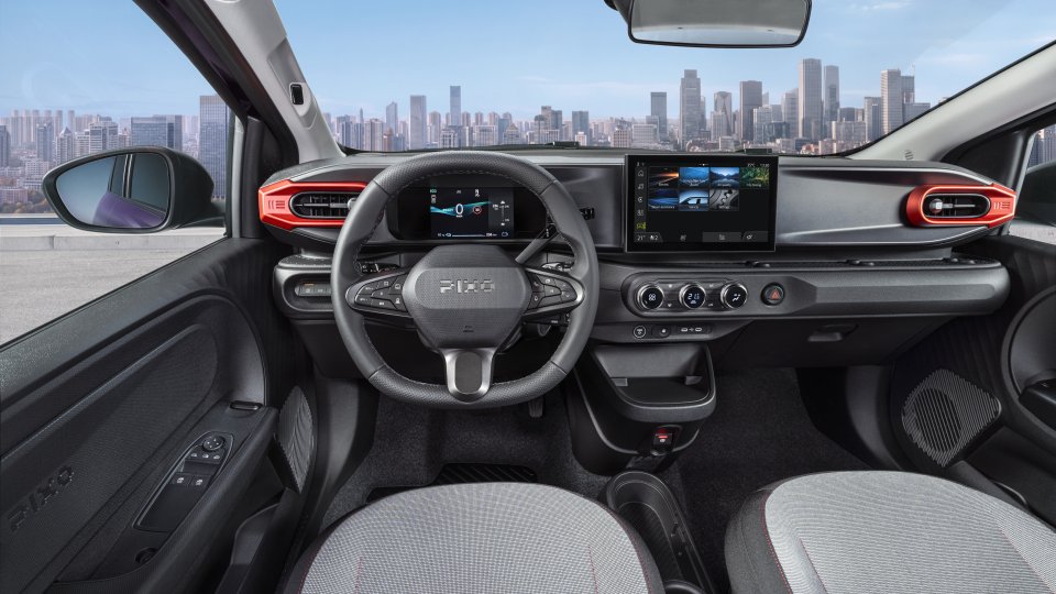 Nissan Pixo cabin with digital displays, infotainment and climate controls