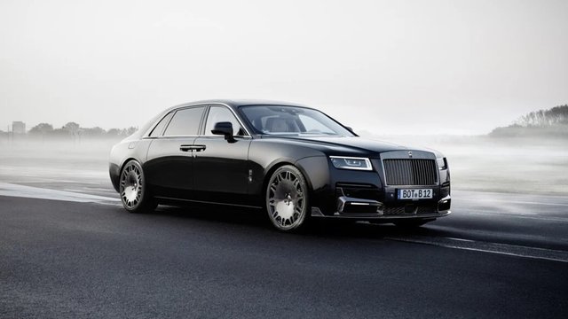 Black BRABUS 700 based on a Rolls-Royce Ghost Extended on a misty roadway
