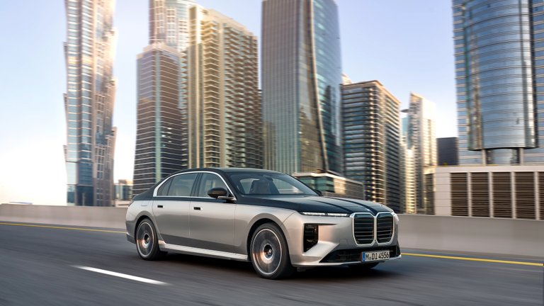 BMW 7 Series luxury sedan driving through a city