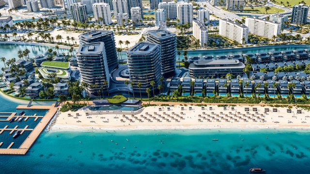 Aerial rendering of BRABUS Island Abu Dhabi featuring waterfront towers, villas, beach, and marina