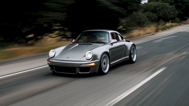 Silver RUF EHRA driving on a winding road