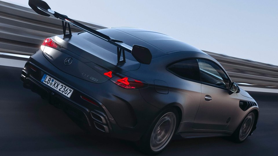 Mercedes-AMG CLE 646 Spezialanfertigung driving from the rear with illuminated taillights and rear wing