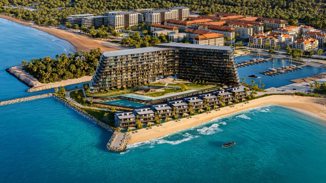 Aerial rendering of BRABUS Island Baku showing beachfront residences, marina, and resort buildings