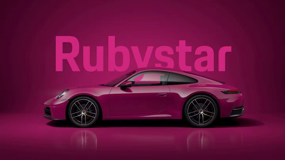 Porsche 911 finished in Rubystar against a matching studio backdrop