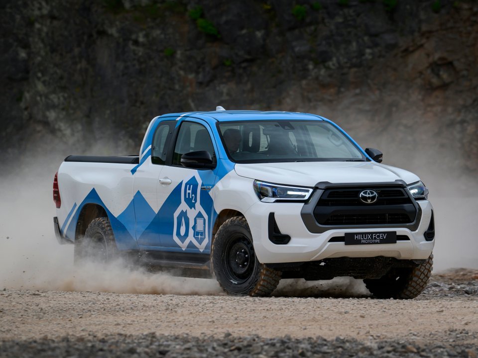 Toyota Hilux FCEV prototype driving on a gravel surface
