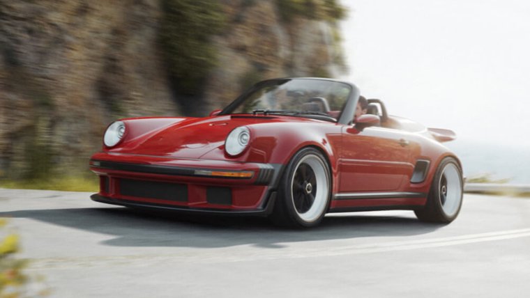 Red Singer 911 Carrera Cabriolet driving on a road