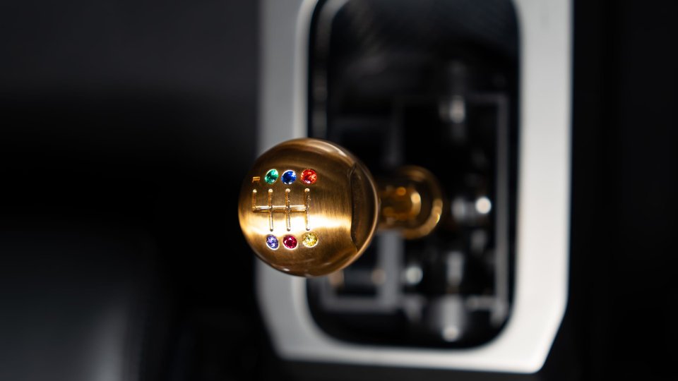 Project Endgame bronze manual shift knob set with multicolored gemstones