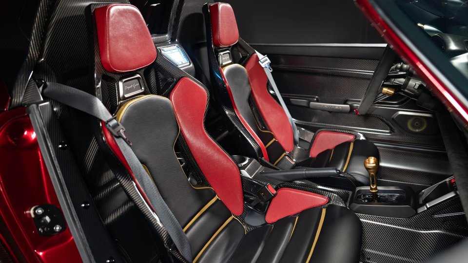 Project Endgame red-and-black bucket seats and gold-toned manual shifter