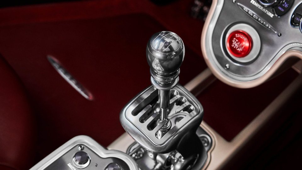 Pagani Utopia exposed-gate seven-speed manual gear selector in a red-trimmed cockpit