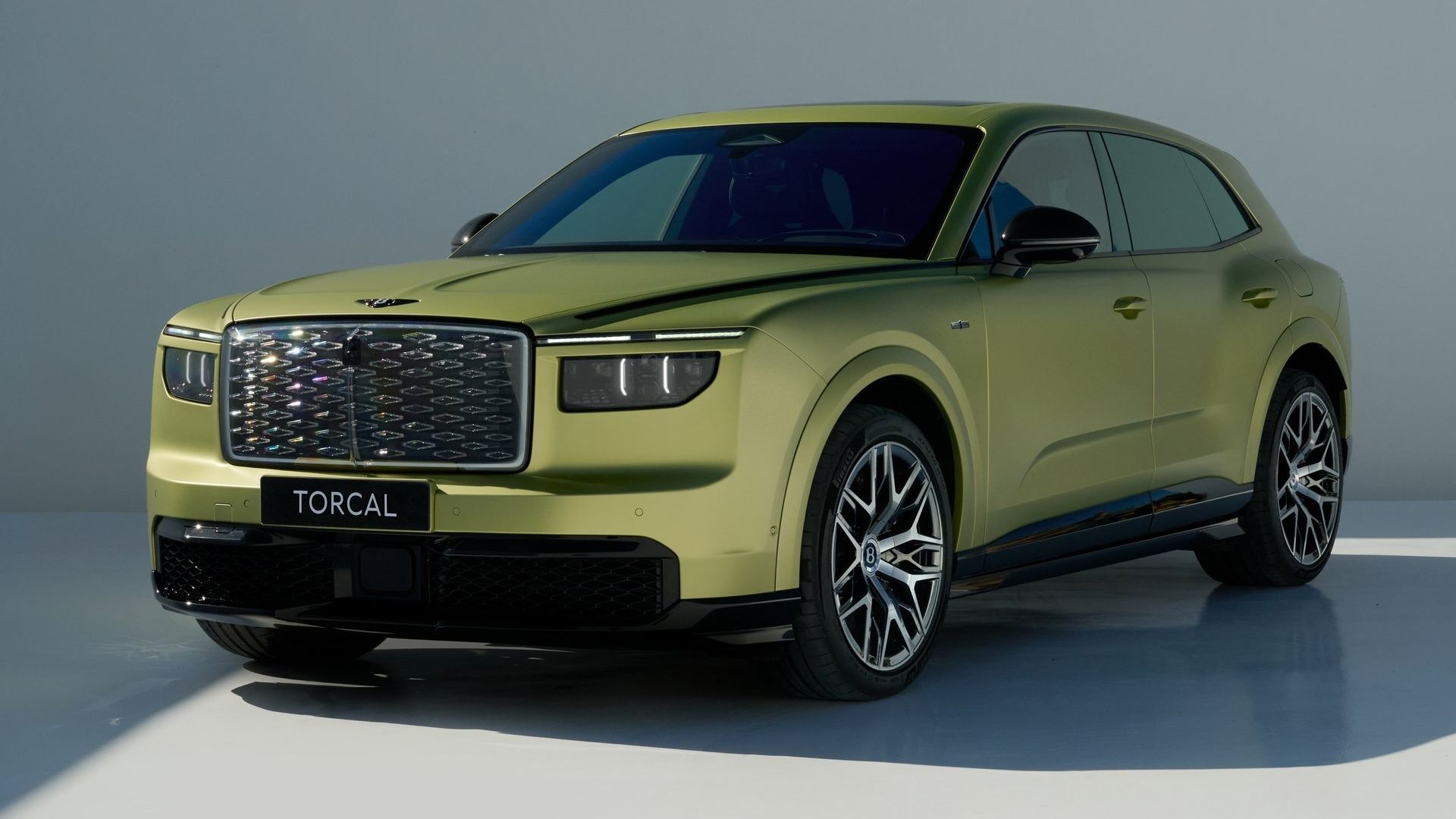 Green Bentley Torcal electric SUV in front three-quarter studio view