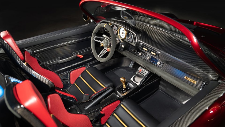 Project Endgame cabin with red-and-black seats, carbon fiber, and gold accents