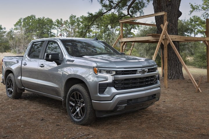 Chevrolet Silverado 1500 parked in a wooded clearing