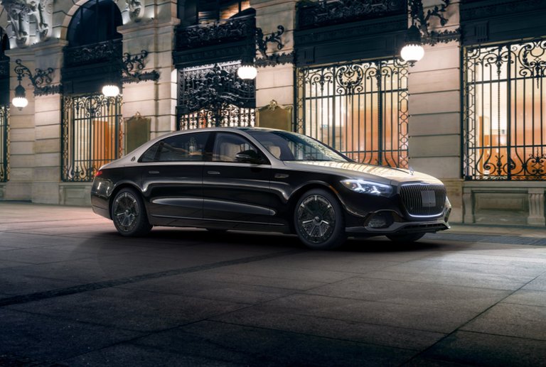 Two-tone Mercedes-Maybach S-Class sedan parked at night