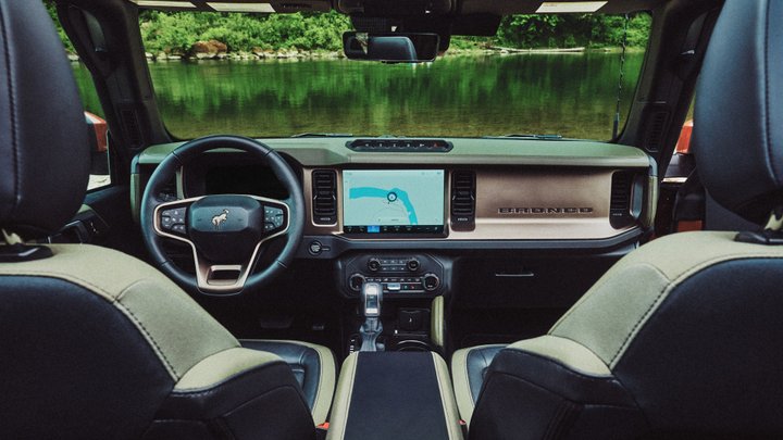 Ford Bronco Filson cabin with two-tone front seats, navigation screen, and Bronco-branded dashboard