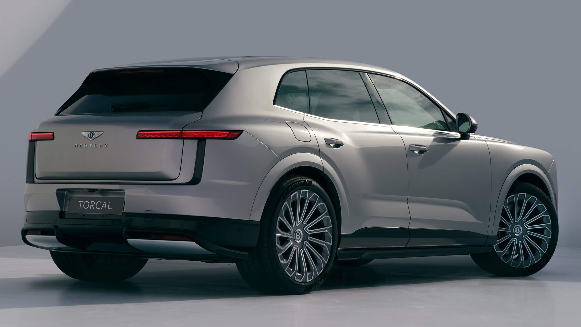Bentley Torcal electric SUV in rear three-quarter studio view