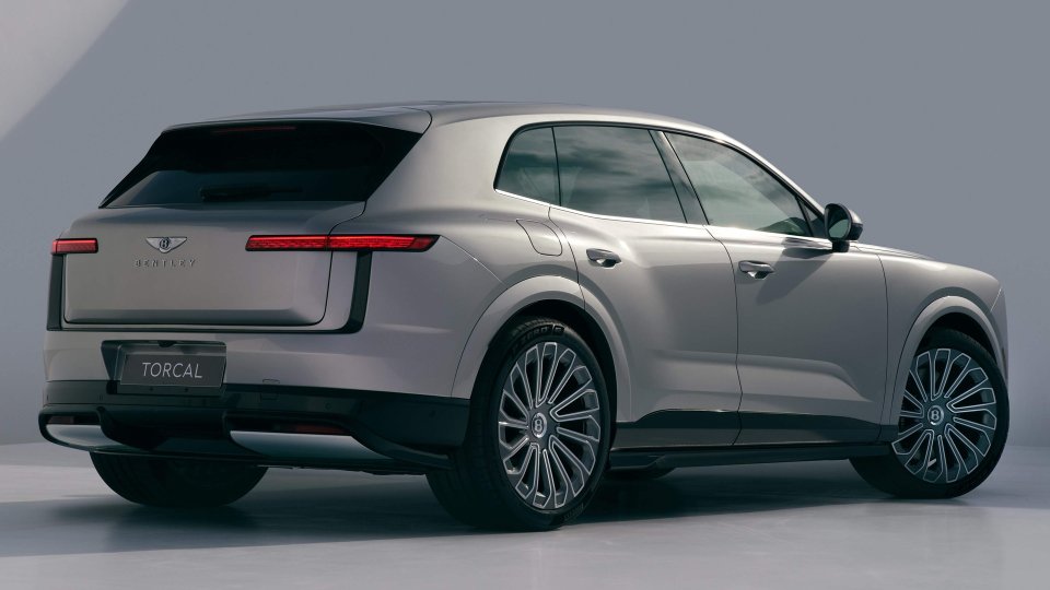 Rear three-quarter view of the silver Bentley Torcal electric luxury SUV in a studio