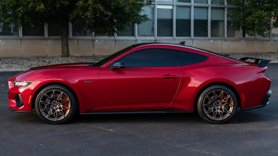 Red Ford Mustang GT parked in side profile