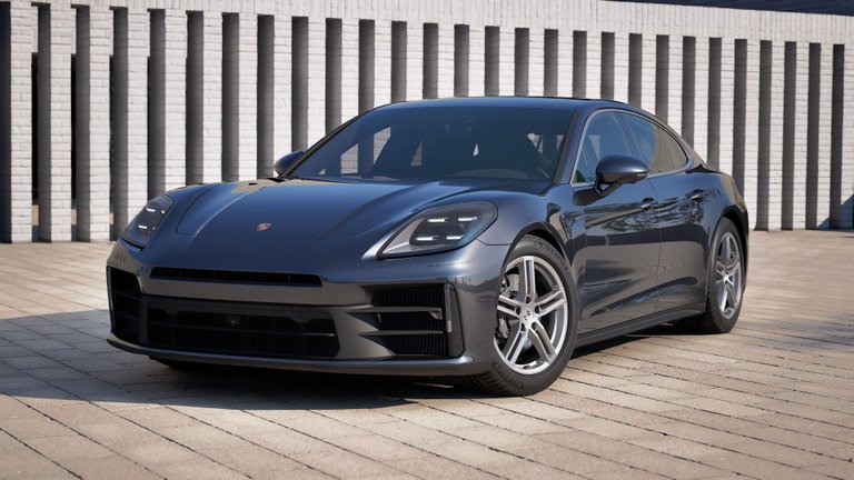 Dark gray Porsche Panamera shown in front of a white brick facade