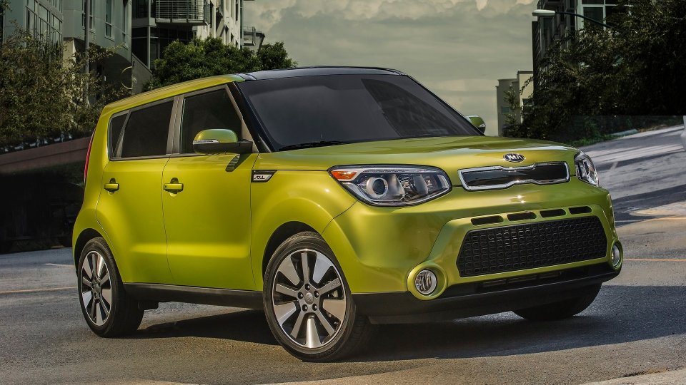 Lime-green Kia Soul on a city street
