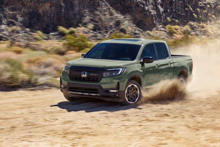 Honda Ridgeline driving on an unpaved desert road