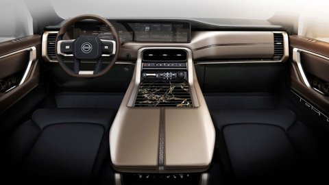 Nissan Armada interior with a digital dashboard, center console and low-mounted gear-selector buttons