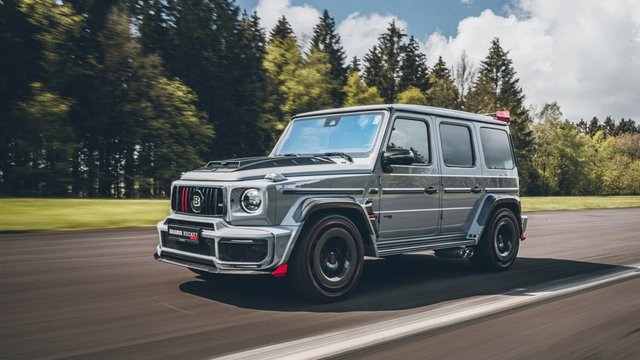 Gray BRABUS 900 Rocket Edition based on a Mercedes-AMG G 63 driving on a forest road