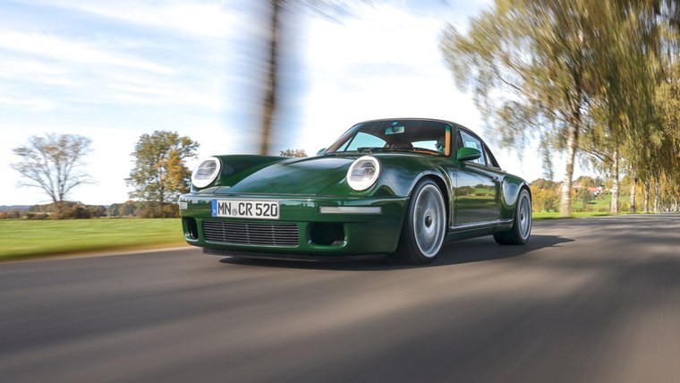 Green RUF SCR driving on a rural road