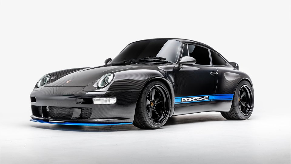 Black exposed-carbon Gunther Werks 400R Porsche 993 coupe with blue graphics