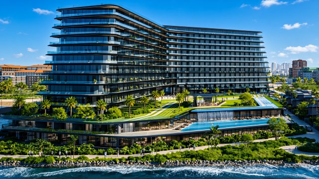 Waterfront rendering of BRABUS Island Baku with a landscaped pool deck and curved residential building