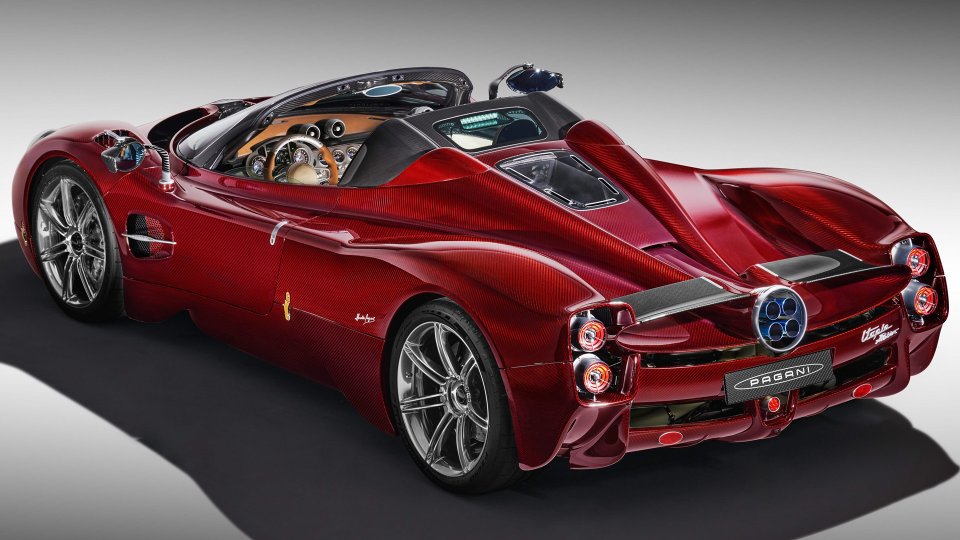 Red carbon-fiber Pagani Utopia Roadster viewed from the rear three-quarter angle