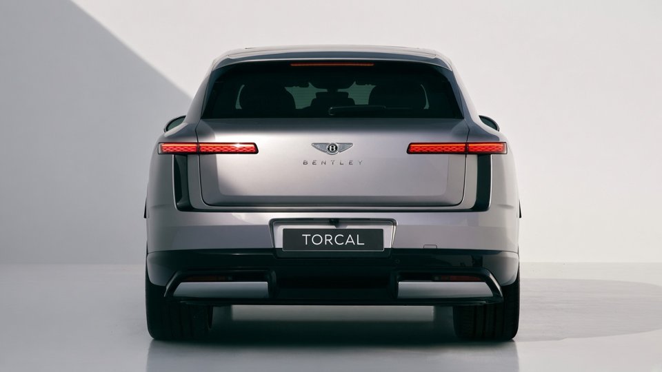 Straight-on rear view of a silver Bentley Torcal in a studio