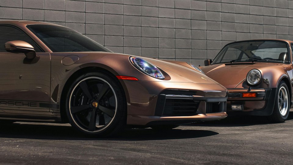 Modern Porsche 911 Turbo S and classic Porsche 911 in metallic copper-brown paint