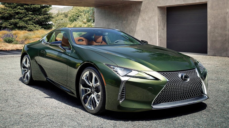 Nori Green Lexus LC 500 parked beside a modern garage