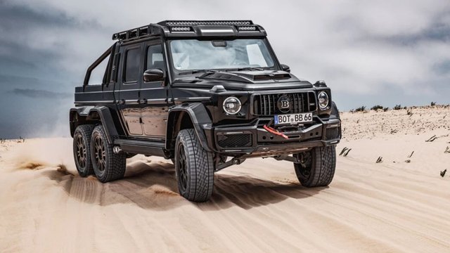 Black BRABUS XLP 900 6x6 Superblack Mercedes-AMG G 63 pickup on sandy terrain