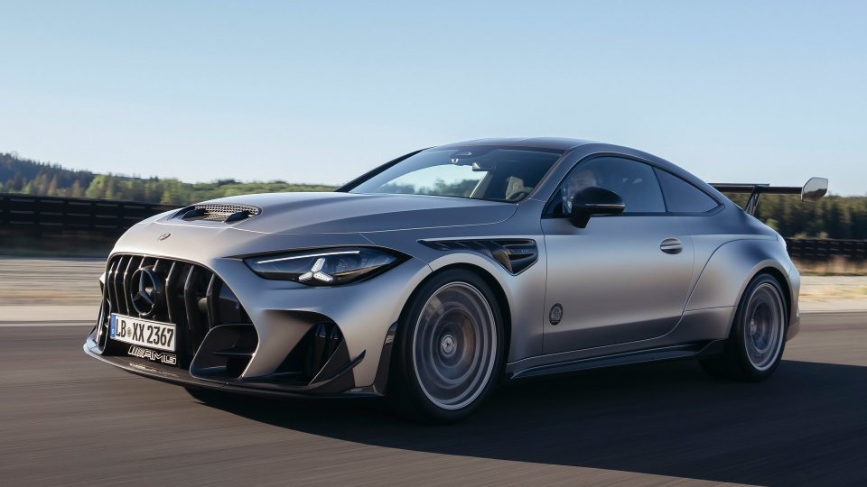Silver Mercedes-AMG CLE 646 Spezialanfertigung driving at speed, viewed from the front three-quarter angle