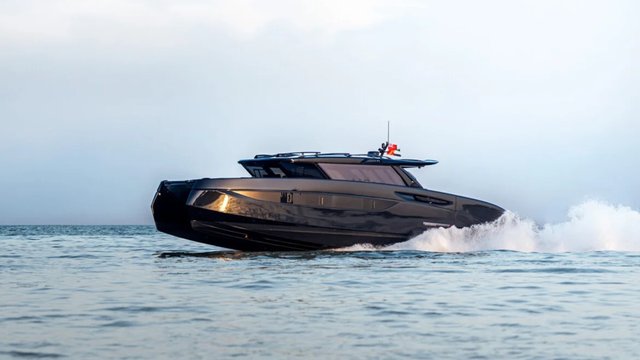 Dark BRABUS ULTIMA 55 catamaran underway on open water