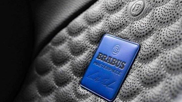 Blue BRABUS Masterpiece plaque on perforated leather interior trim
